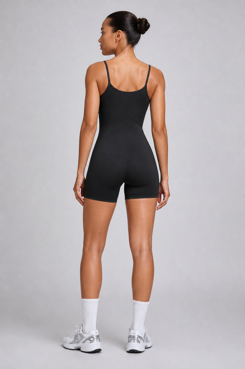 TWENTY Fitness TWENTY Sculpt Unitard in midnight black, form-fitting activewear with long sleeves and sleek design.