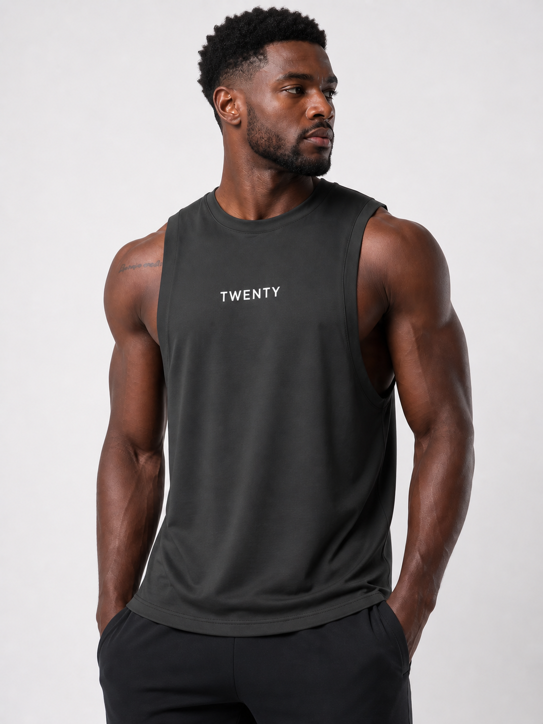 TWENTY Performance Vest in midnight black, close-up of lightweight athletic vest with fitted design and breathable fabric.